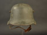 helmet on a stand on a gray background with a brown strap