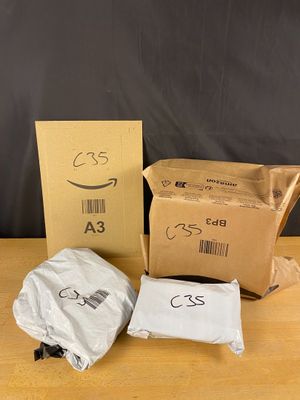 two bags of food sitting on top of a wooden table next to a box
