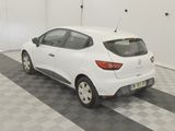 the white car is parked in the garage on the checkered floor