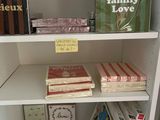 many books on a shelf in a book case