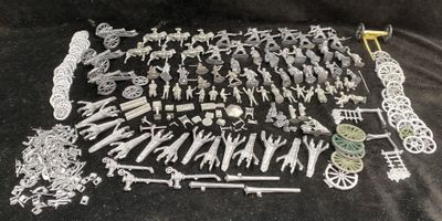 a lot of toy soldiers and weapons on the table