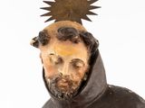 a statue of a man with a star on top of his head