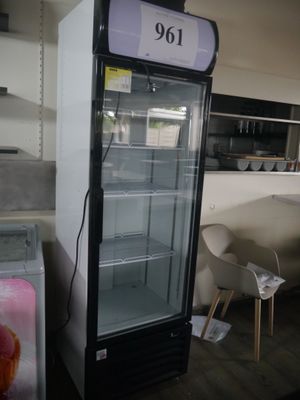a refrigerator with a price tag on it in a store
