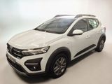 a white car parked in a room with a white background