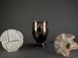 three vases sitting next to each other on a table