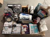 a box full of assorted electronics on the floor