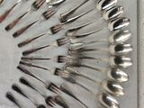 a lot of spoons and forks arranged in a circle