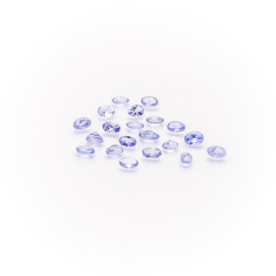 a pile of blue sapphires on a white background