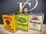 three tins that are sitting on a table