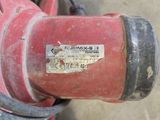 a red fire hydrant that has a sticker on it