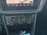 the dashboard of a car with a gps device in the center of it