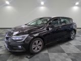 the black volkswagen e - golf is parked on a checkered tile floor