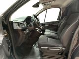the interior of a car with the driver ' s seat folded down