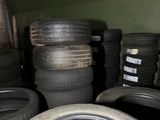 a lot of tires stacked on top of each other