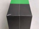 a black box with a green strip on it
