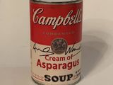 campbell ' s cream of asparagus soup in a can on a white surface
