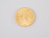 an image of a gold coin on a white surface
