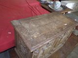an old wooden chest sitting on a table in a room