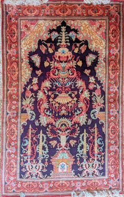 an oriental rug with a floral design on a purple background