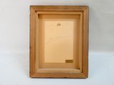 une photo d'un cadre en bois sur lequel figure un dessin