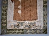 a close up of a piece of cloth with a bird on it