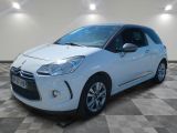 a white citrole is parked in a room with a checkered floor