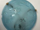 a glass plate with a rope around it on the wall