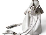 an image of a white purse with a tassel on it