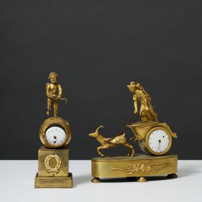 two clocks that are sitting on top of each other