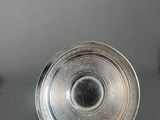 a silver plate that is sitting on a table
