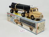 a toy truck with a large loader on top of it