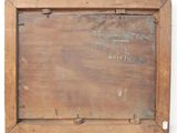 an old wooden box with writing on it sitting on top of a table