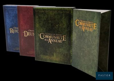 three books are lined up in a row on a black background