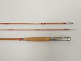 three different types of fishing rods on a white surface
