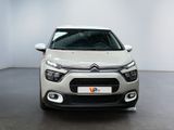 the front of a white citrole parked in a white room