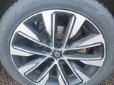 the tire of a car is shown on the pavement in the parking lot
