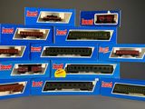 a lot of toy trains that are in the boxes