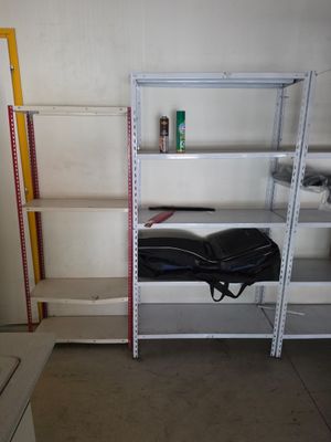 a shelf with a guitar case on it in a room