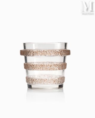 an image of a glass cup with a cork band around it
