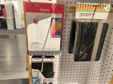 a display of cell phones on the wall in a store
