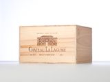 a close up of a wooden box with a bottle of wine in it
