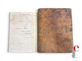 an old book with a piece of paper on it