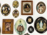 a lot of plates and pictures on the wall