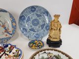 a lot of plates and bowls on the table