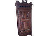 an old wooden cabinet with carvings on the doors