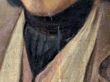 portrait of a man in a brown coat and a black tie