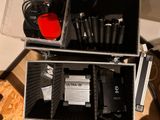 two cases with microphones in them sitting on a table