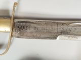a close up of a knife with writing on it
