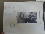 a person holding a piece of paper with a picture on it