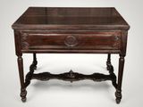 an old wooden table with a drawer on top of it